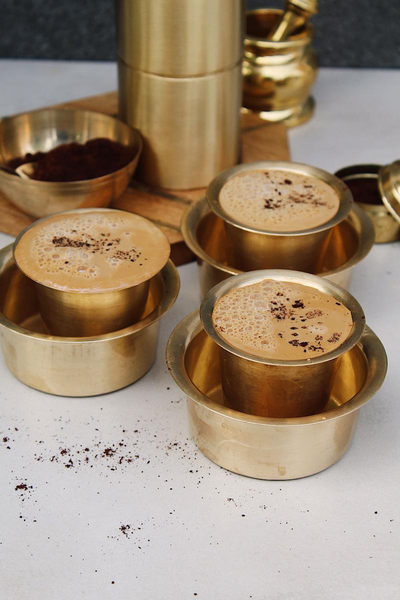 Traditional South Indian filter coffee in a metal dabara tumbler